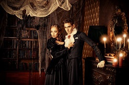 gothic-vampires-beautiful-man-and-woman-vampires-dressed-in-medieval-clothing-stand-in-a-room-of-the-stock-photograph_csp33518292